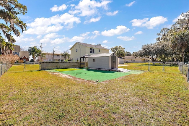 view of yard with a storage unit