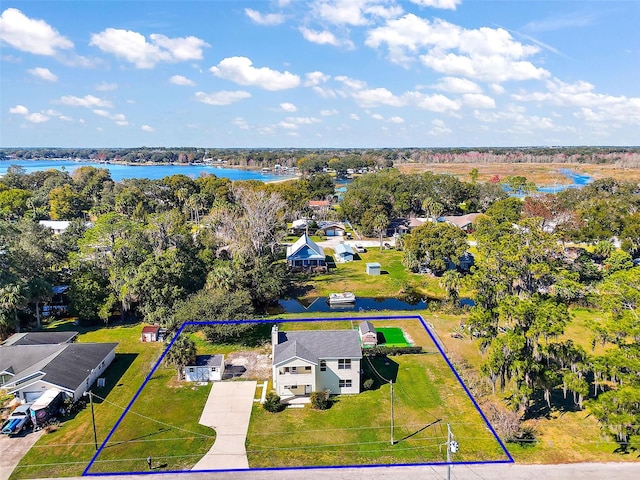 birds eye view of property with a water view