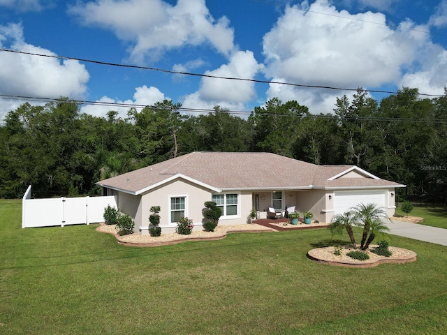 ranch-style house with a garage and a front lawn