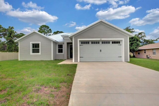 single story home featuring a front yard and a garage