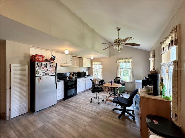 kitchen featuring lofted ceiling, black appliances, light hardwood / wood-style flooring, ceiling fan, and white cabinets