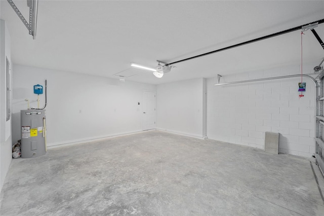 garage featuring a garage door opener and electric water heater