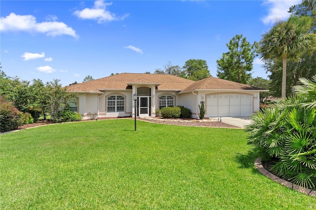 view of front facade featuring a garage and a front lawn