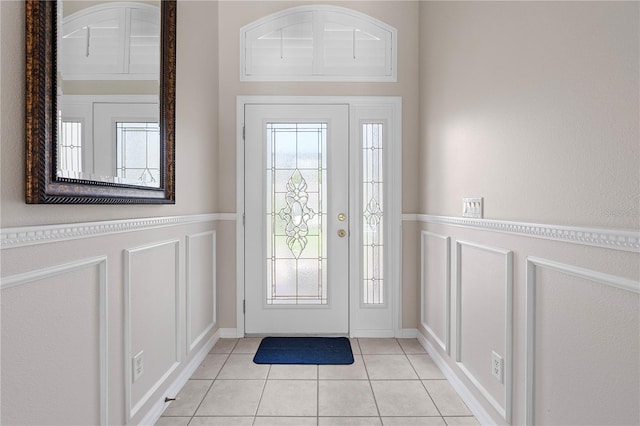 foyer featuring light tile patterned flooring