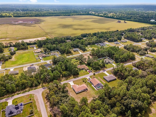 birds eye view of property featuring a rural view