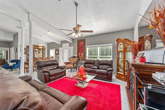 living room featuring vaulted ceiling with beams, a ceiling fan, visible vents, and a textured ceiling