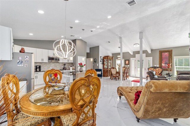 dining area with visible vents, marble finish floor, an inviting chandelier, vaulted ceiling, and french doors