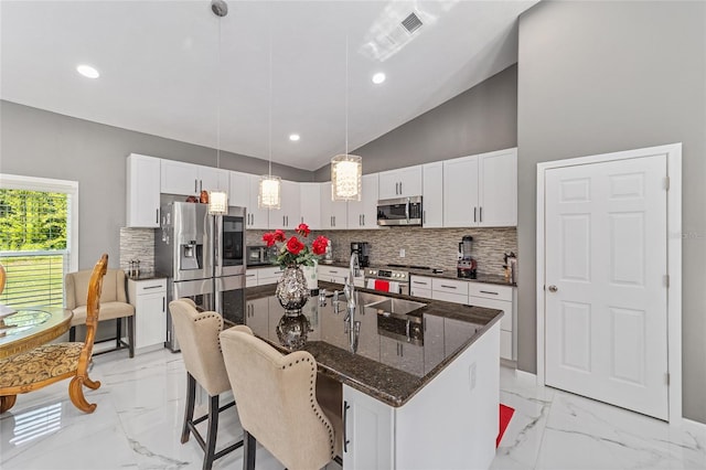 kitchen featuring marble finish floor, stainless steel appliances, a sink, and visible vents