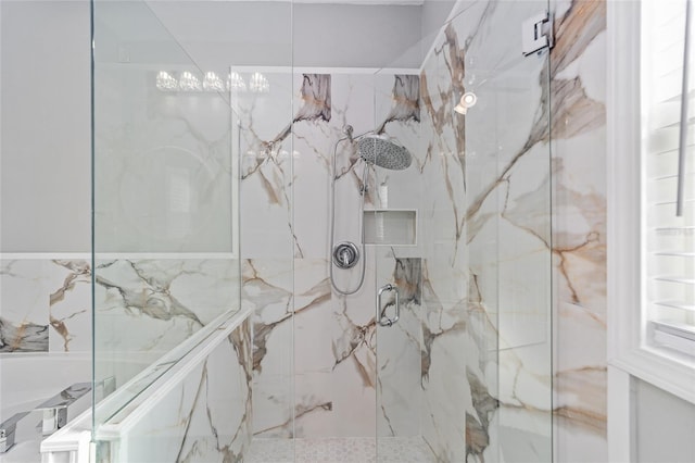 bathroom with a marble finish shower