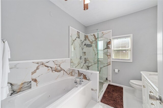 bathroom featuring a marble finish shower, a ceiling fan, toilet, a whirlpool tub, and vanity