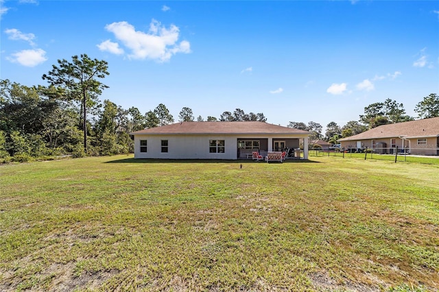 exterior space featuring a front lawn and fence