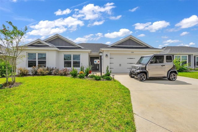 single story home with driveway, a garage, board and batten siding, and a front yard