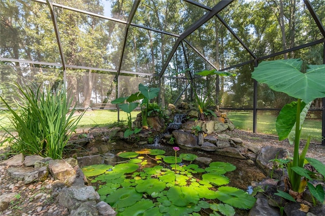 view of yard with glass enclosure