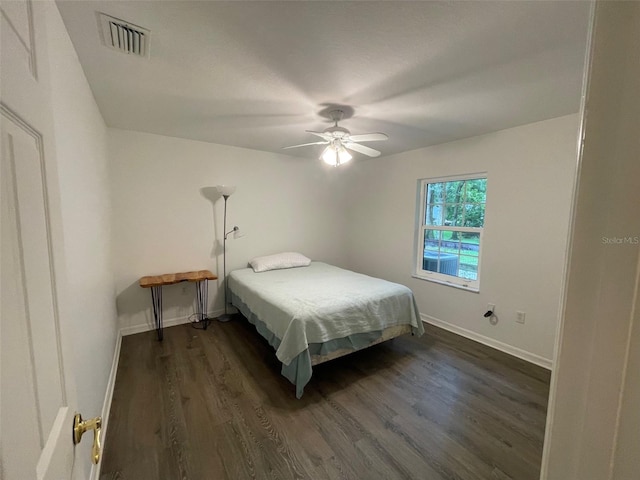 bedroom featuring ceiling fan and dark hardwood / wood-style flooring