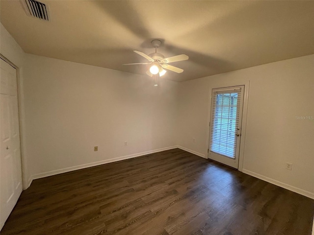 unfurnished bedroom with ceiling fan and dark hardwood / wood-style floors