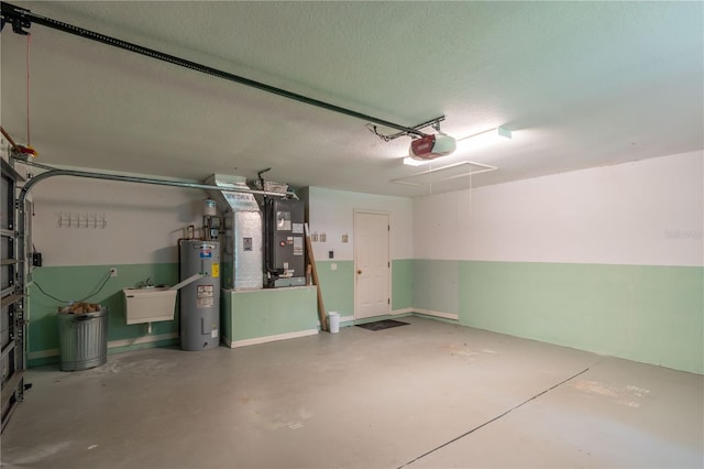 garage featuring a garage door opener, heating unit, and water heater