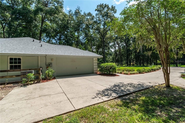 view of side of home with a garage