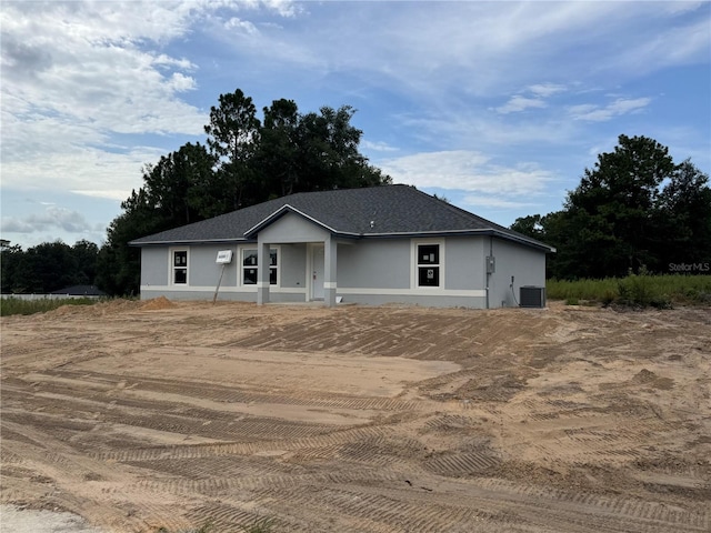 single story home featuring central air condition unit