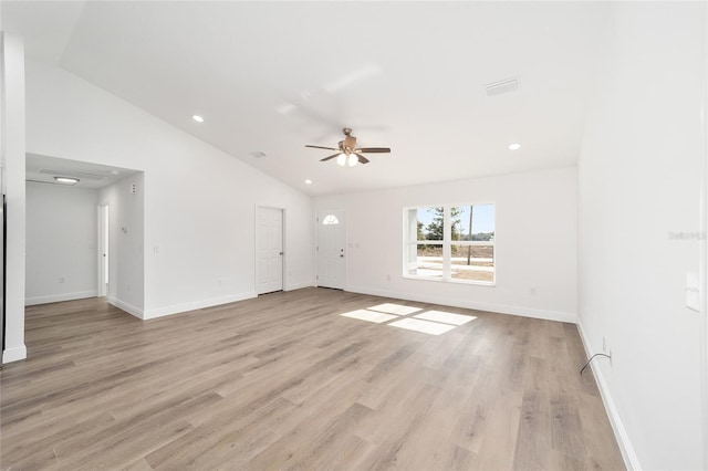 unfurnished living room featuring ceiling fan, lofted ceiling, and light hardwood / wood-style floors