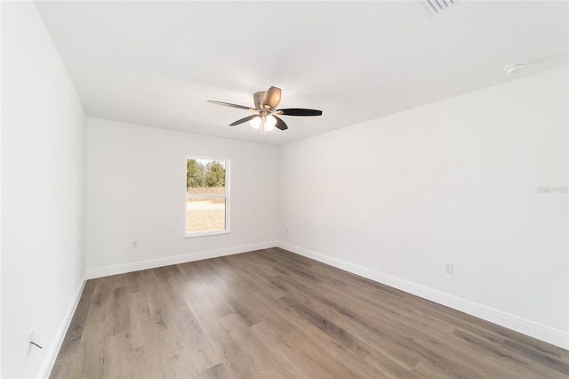 empty room featuring ceiling fan and light wood-type flooring