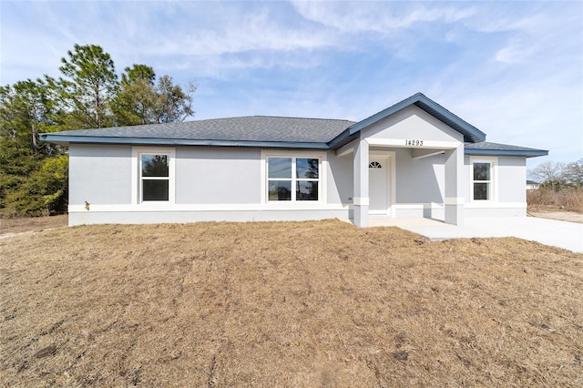 ranch-style house with a front yard