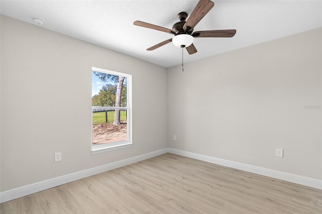 unfurnished room featuring ceiling fan and light hardwood / wood-style flooring