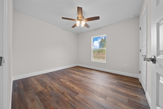 empty room with ceiling fan and dark hardwood / wood-style floors