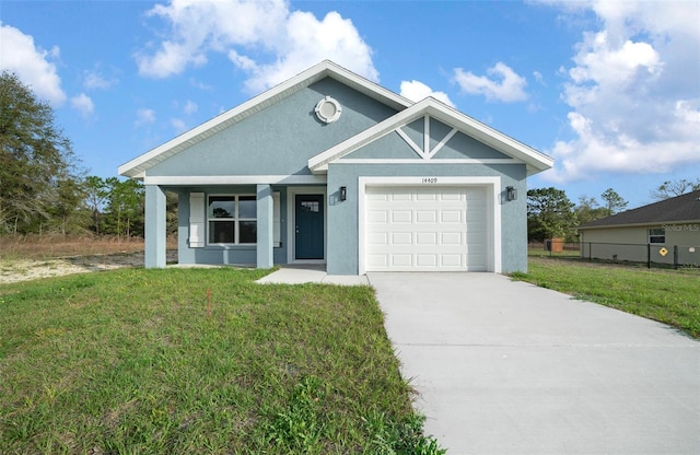 view of front facade featuring a garage and a front yard