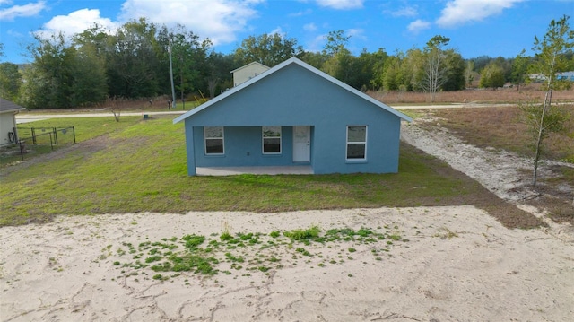 view of property exterior featuring a lawn