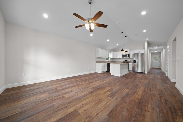 kitchen featuring stainless steel appliances, decorative light fixtures, a center island, white cabinetry, and dark hardwood / wood-style floors