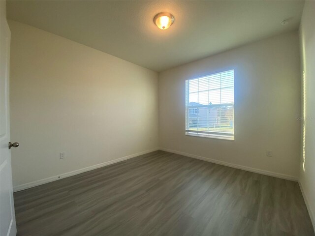 unfurnished room featuring hardwood / wood-style floors