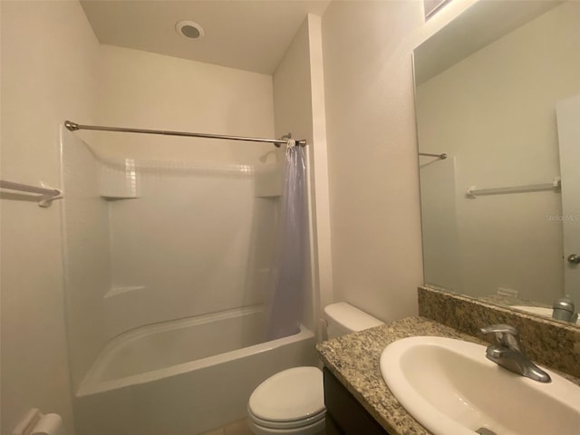 full bathroom featuring toilet, shower / bathtub combination with curtain, and vanity