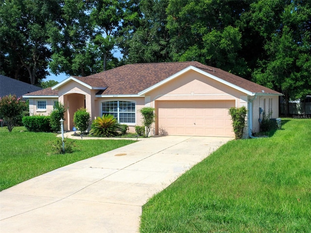 single story home with a garage and a front yard