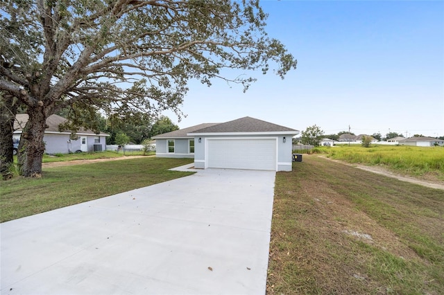 ranch-style house featuring a garage and a front yard