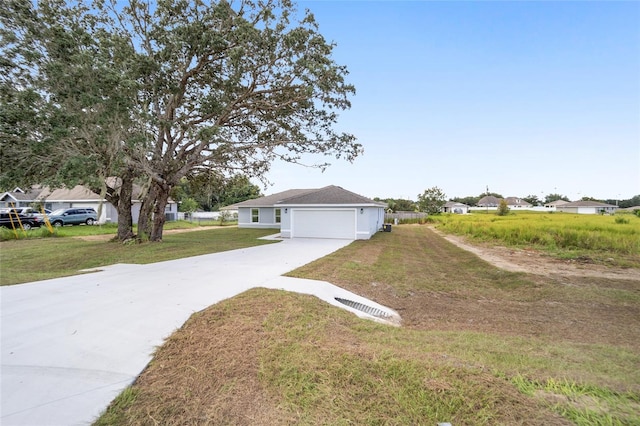 exterior space featuring a garage and a front lawn