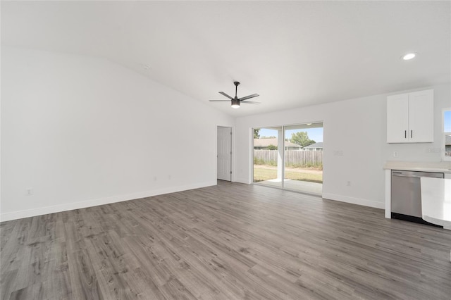 unfurnished living room featuring ceiling fan, light wood-type flooring, and lofted ceiling