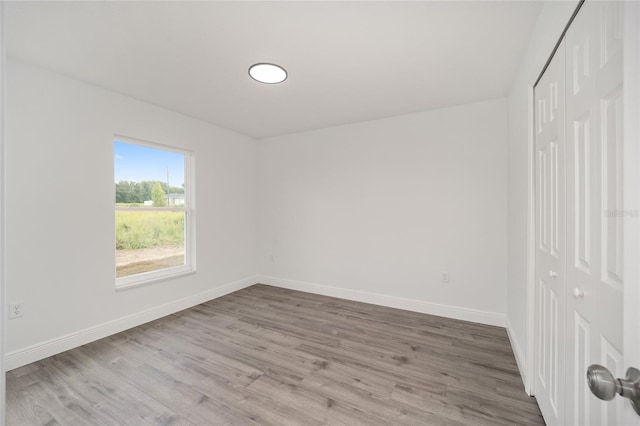 empty room featuring wood-type flooring