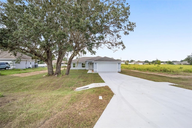 single story home featuring a front yard and a garage