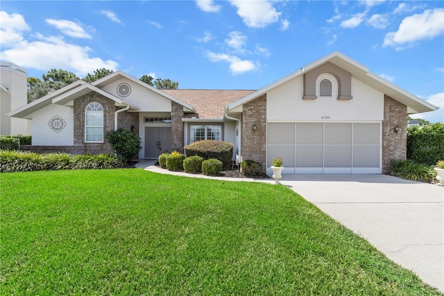 ranch-style house featuring a garage and a front yard