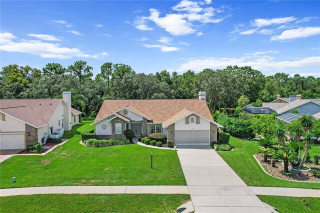 ranch-style home with a garage and a front lawn