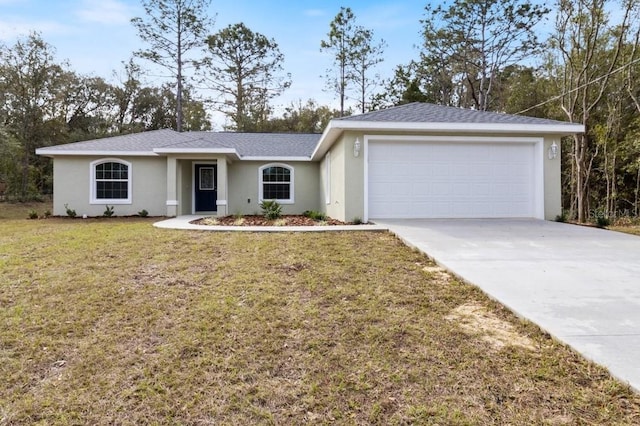 ranch-style house featuring a garage and a front yard