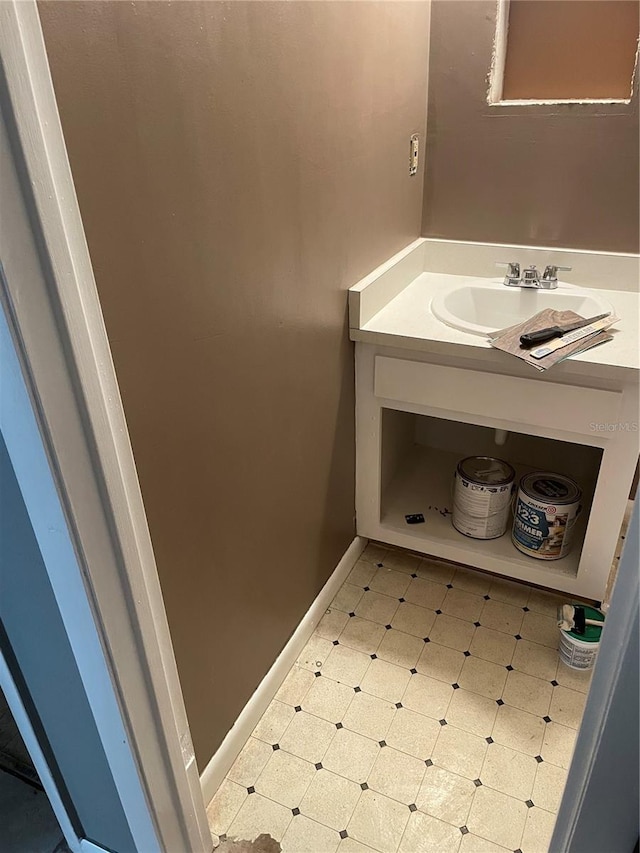 bathroom with tile patterned flooring and vanity