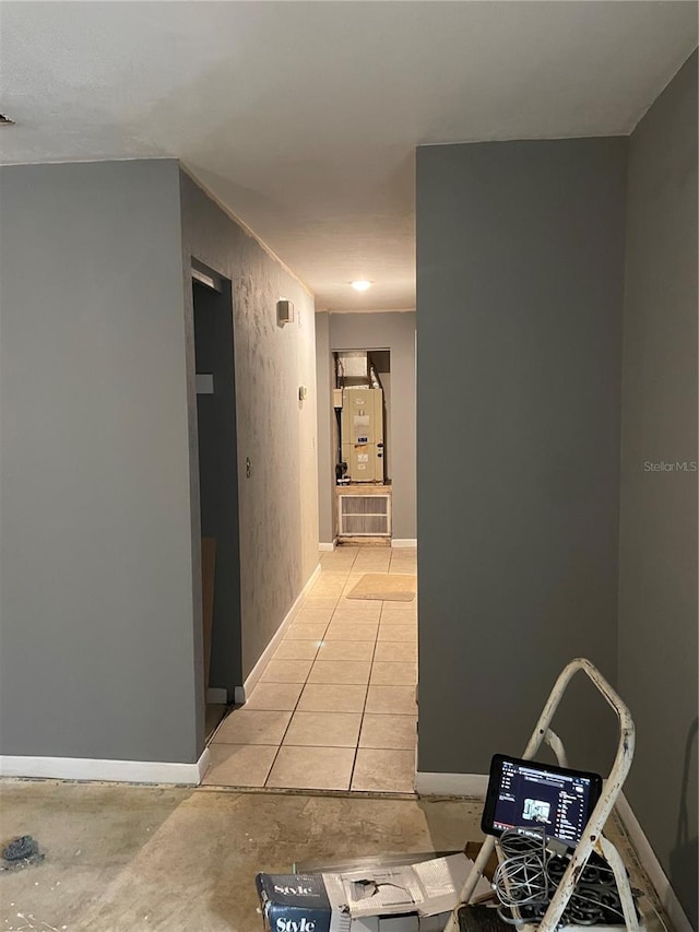 corridor featuring light tile patterned flooring