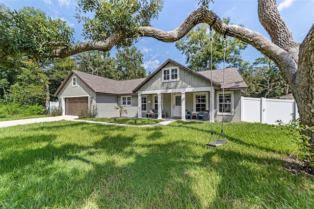 craftsman inspired home featuring a front yard and a garage