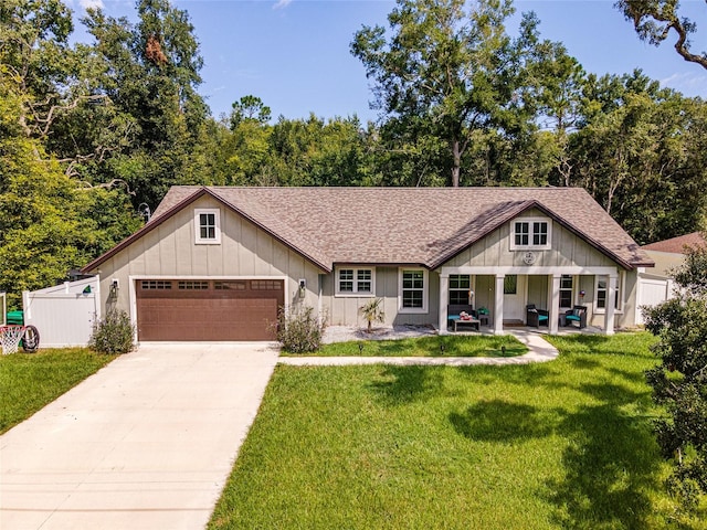 view of front of house featuring a front yard and a garage