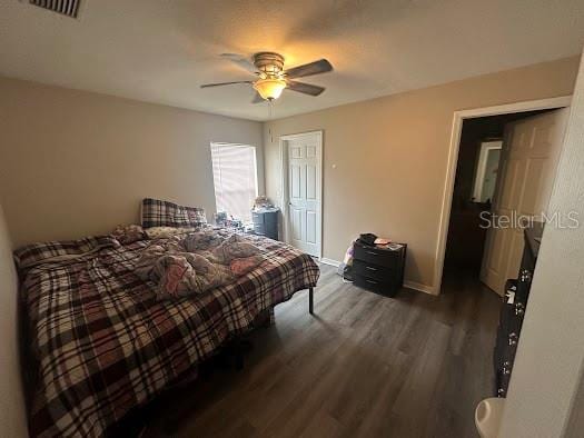 bedroom featuring wood-type flooring and ceiling fan