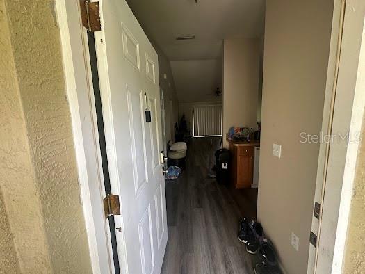 hallway with wood finished floors