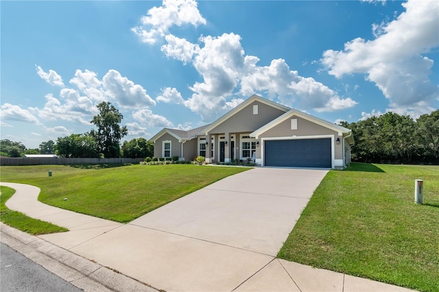 25 NW 45th Loop, Ocala, FL 34475 - view of front of house with an attached garage, a front lawn, stucco siding, and concrete driveway