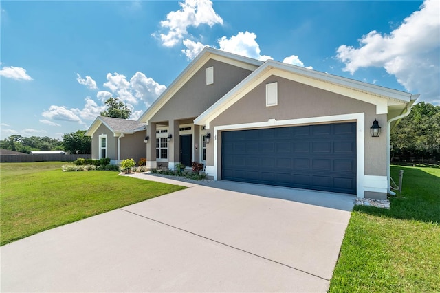 view of front facade with a garage and a front lawn