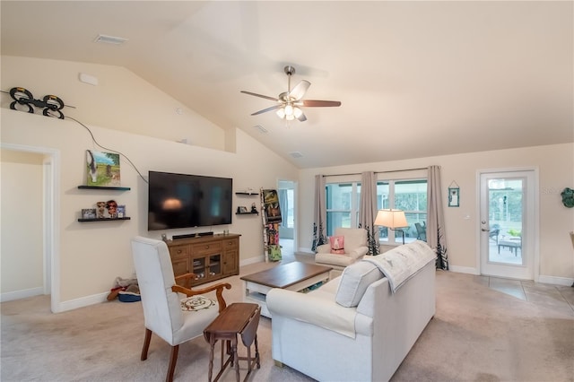 carpeted living room with ceiling fan and lofted ceiling